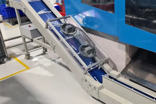 Fan cooling system integrated into the conveyor for cooling products coming out of the plastic injection molding machine.